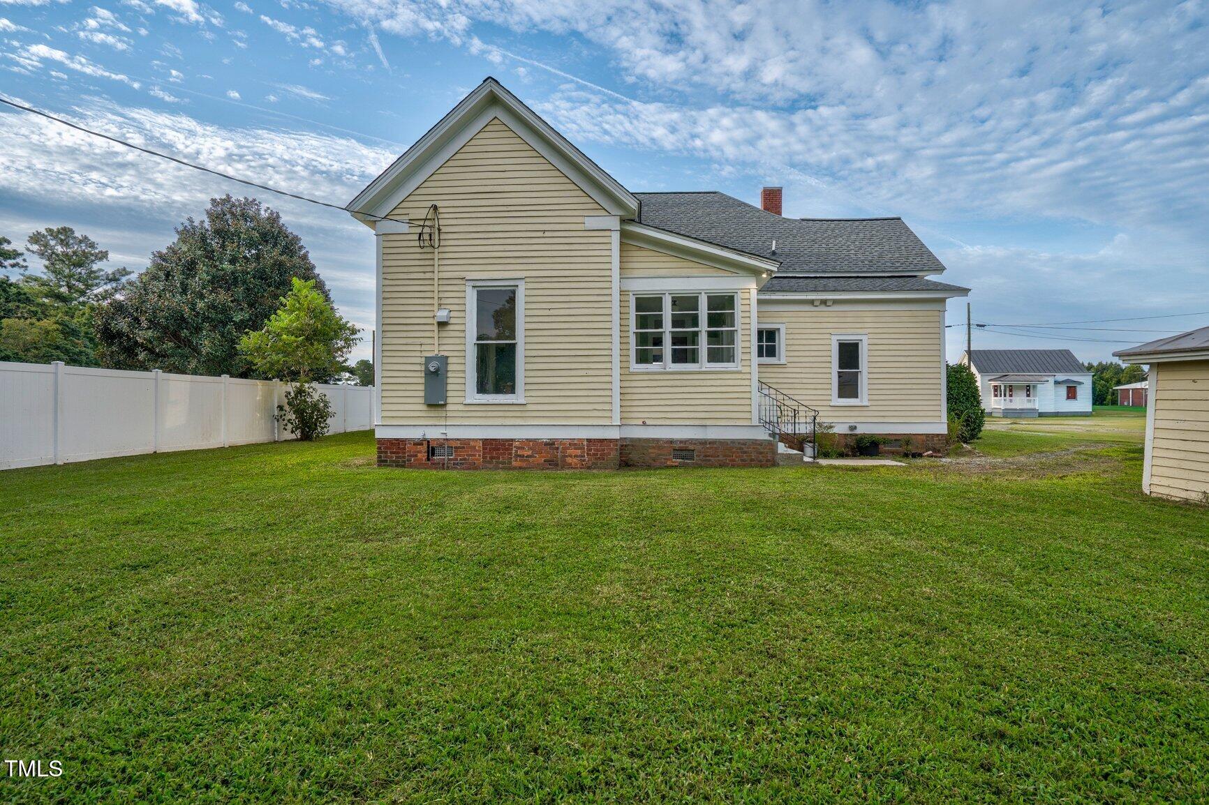 206 West Blalock Road Lucama, NC 27851 - Photo 33 of 35 a front view of house with yard and green space