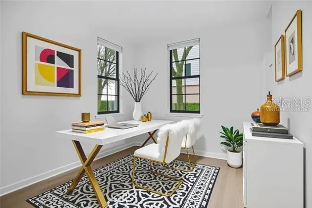 a workspace with furniture and window