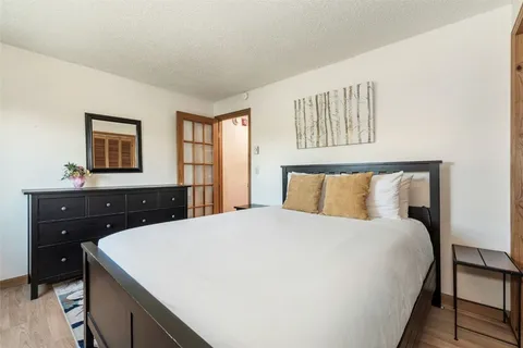 a bedroom with a bed and a dresser