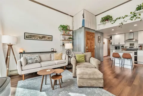 a living room with furniture and a table