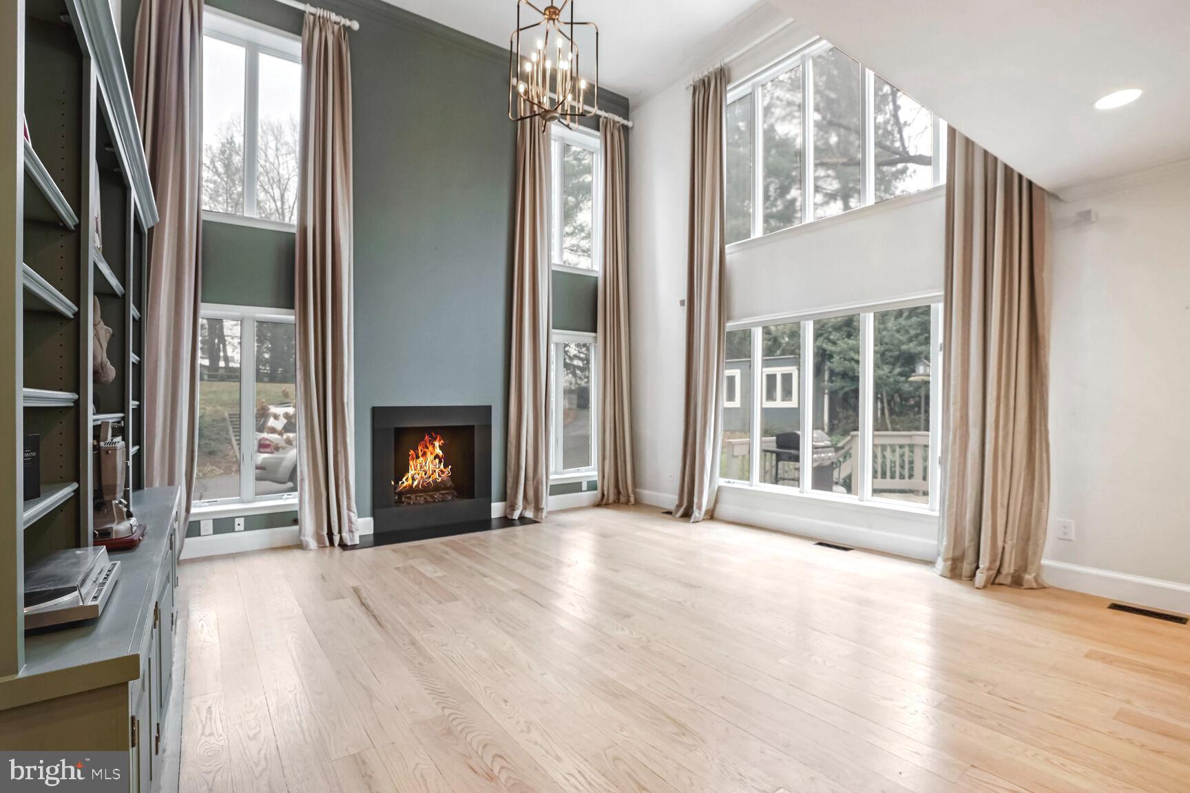 1222 Ranleigh Road McLean, VA 22101 - Photo 1 of 49 a view of an empty room with wooden floor and a window