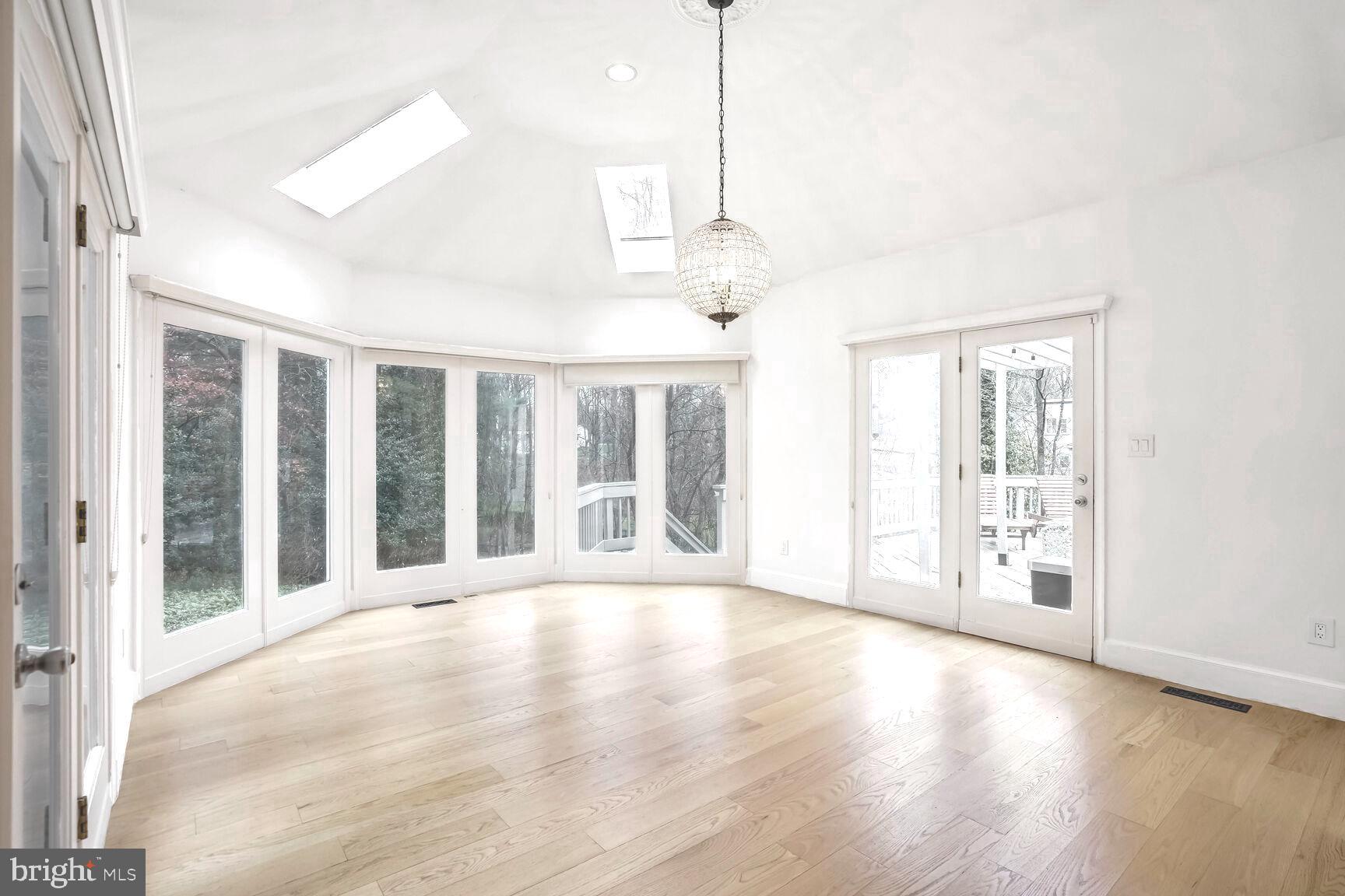 1222 Ranleigh Road McLean, VA 22101 - Photo 15 of 49 a view of an empty room with a window and wooden floor