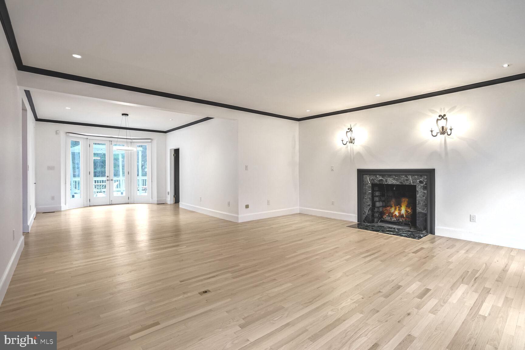 1222 Ranleigh Road McLean, VA 22101 - Photo 21 of 49 a view of empty room with wooden floor and fireplace