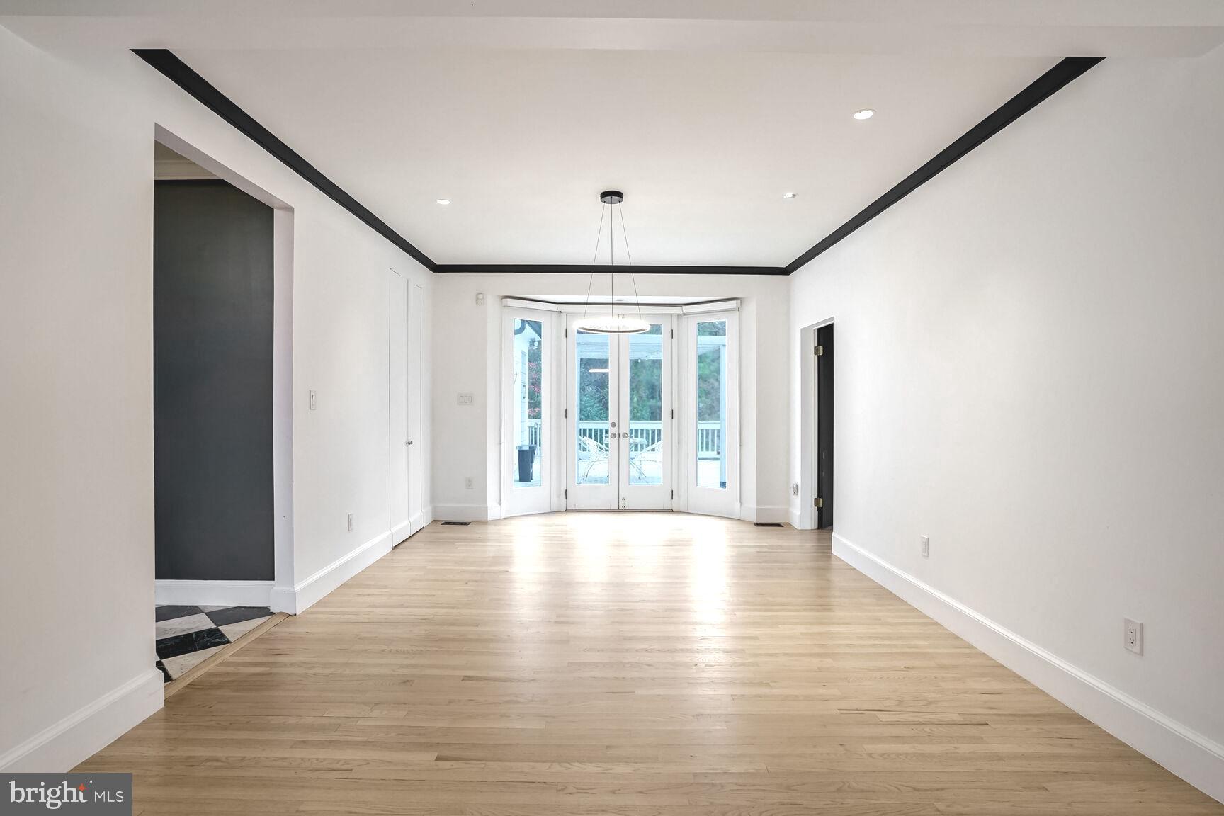 1222 Ranleigh Road McLean, VA 22101 - Photo 23 of 49 a view of an empty room with wooden floor and a window