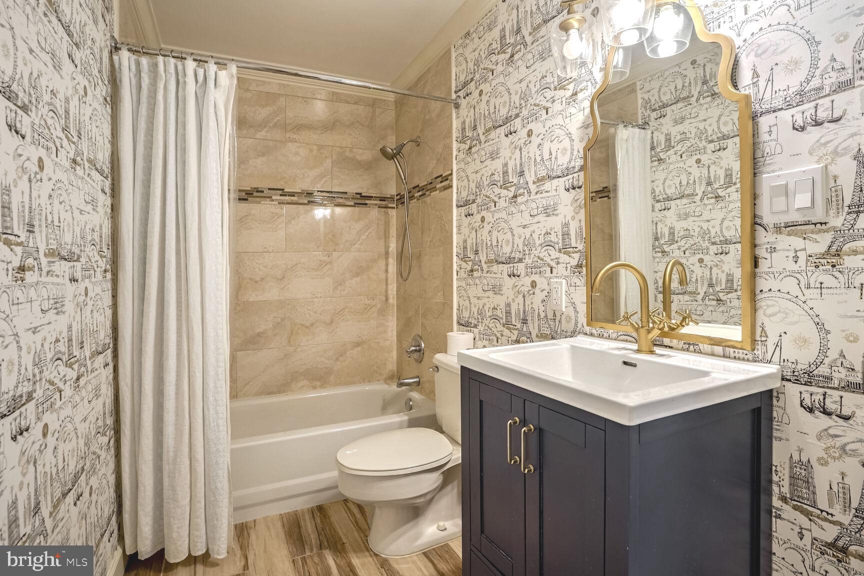 1222 Ranleigh Road McLean, VA 22101 - Photo 33 of 49 a bathroom with a sink toilet and shower