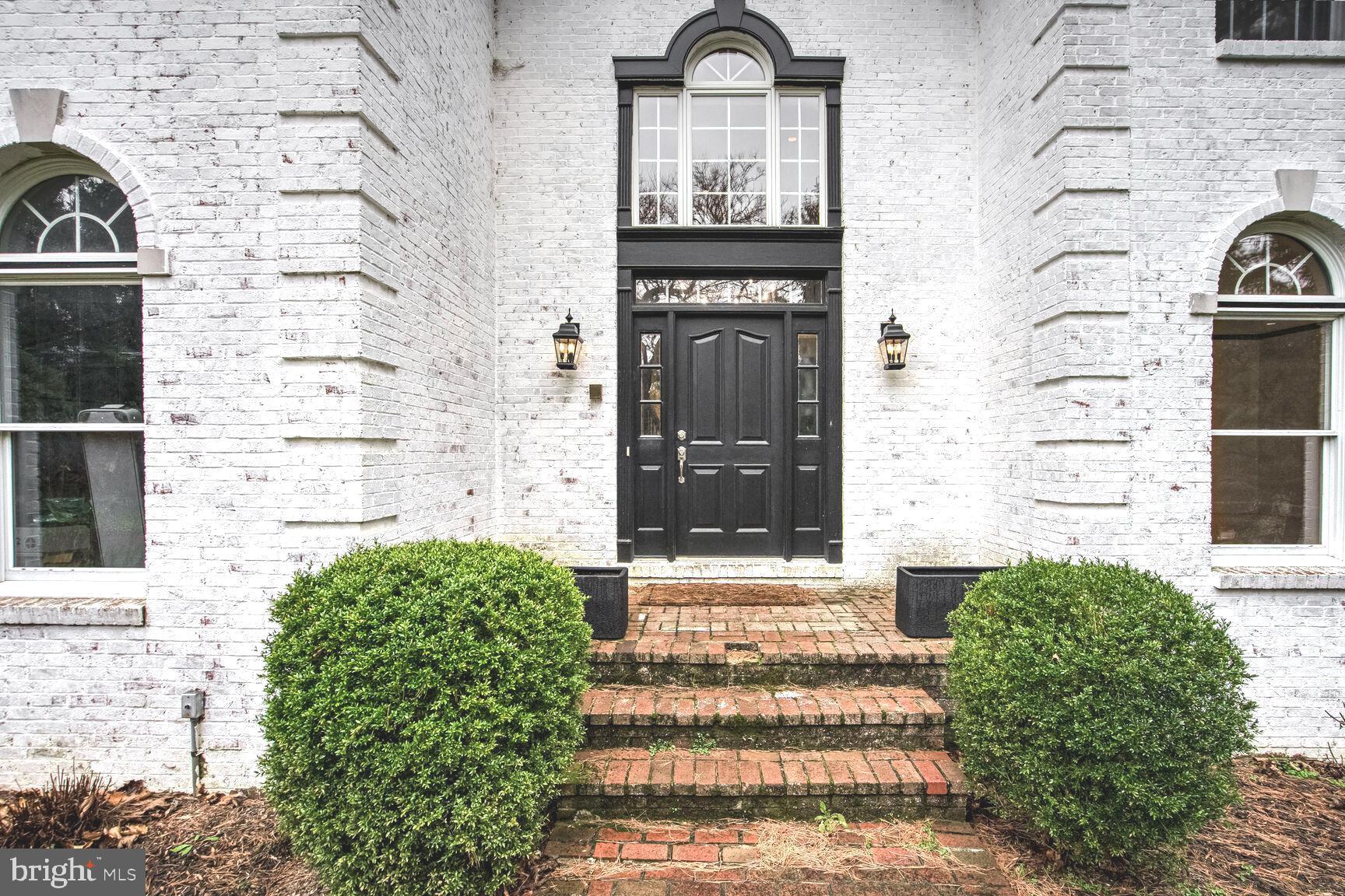 1222 Ranleigh Road McLean, VA 22101 - Photo 44 of 49 a front view of a house with a garden