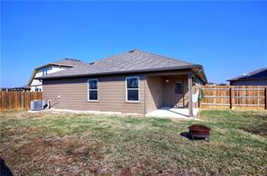 12005 Riparian Road Manor, TX 78653 - Photo 4 of 6 a house view with a backyard space