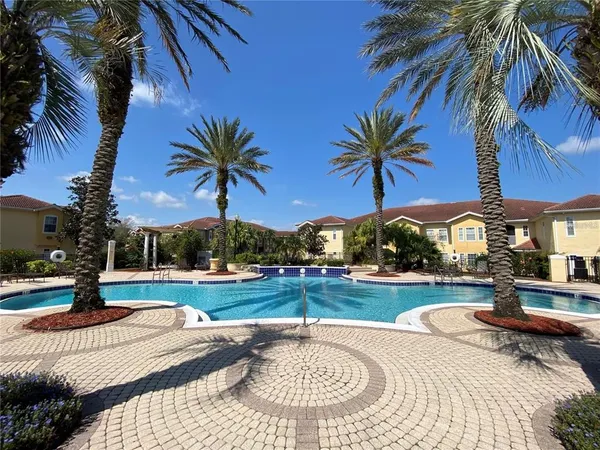 a view of a swimming pool with a yard