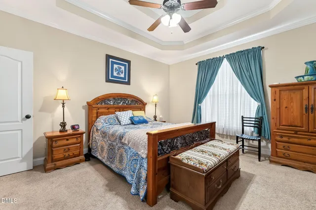 a bedroom with furniture and a window