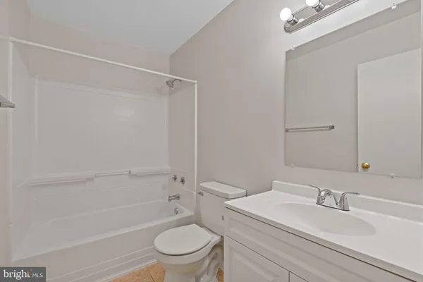 a bathroom with a sink a toilet and a bathtub