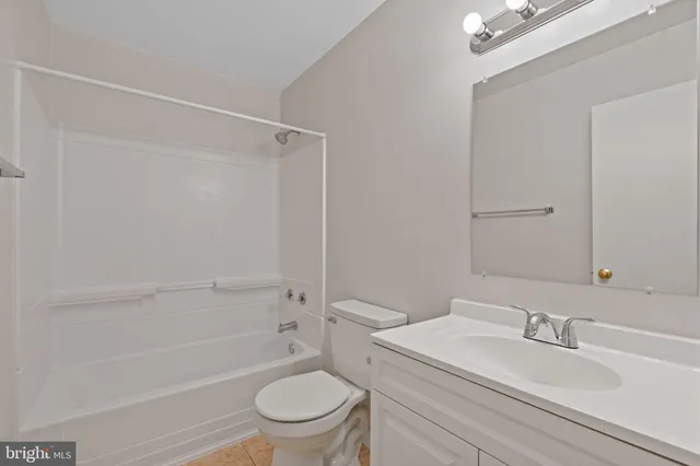 a bathroom with a sink a toilet and a bathtub