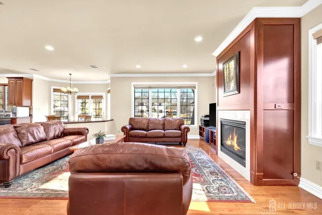 a living room with furniture fireplace and window