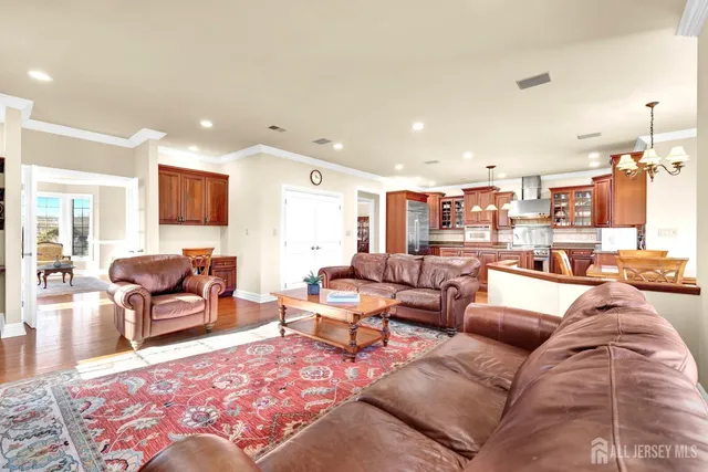 a living room with furniture kitchen view and a table