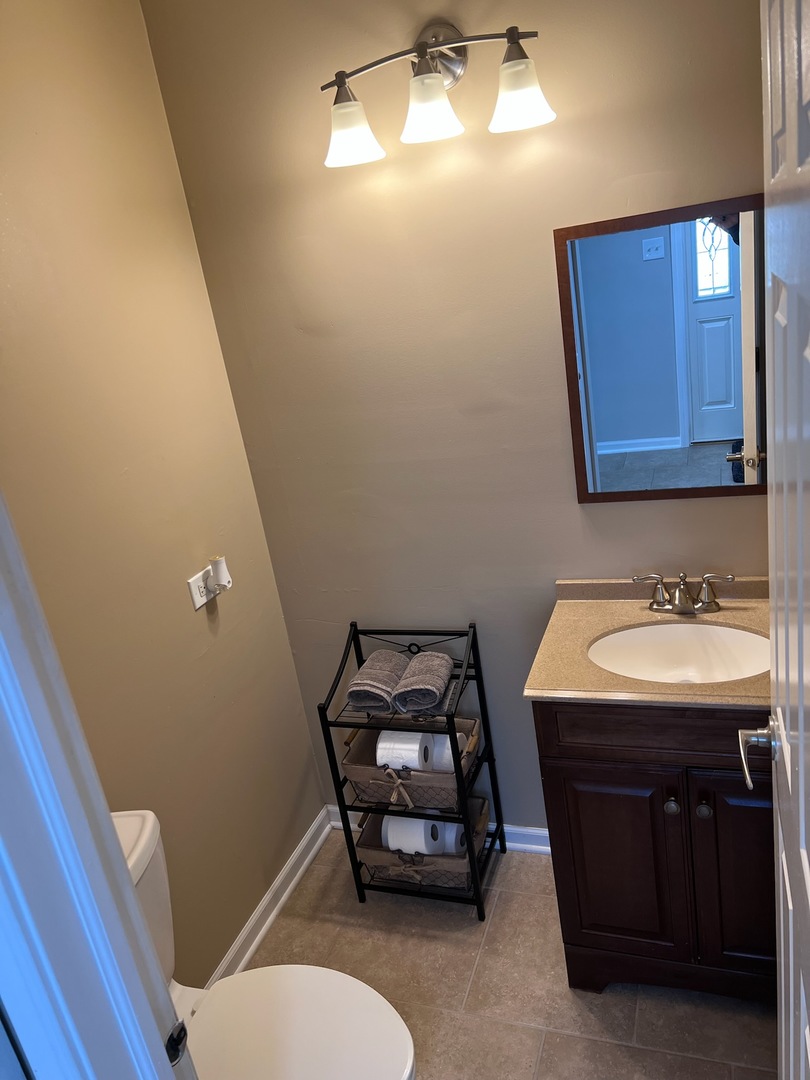 57 Red Barn Road, Unit 1 Matteson, IL 60443 - Photo 12 of 21 a bathroom with a sink toilet and mirror
