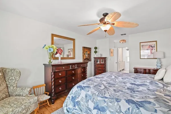a bedroom with furniture and a window