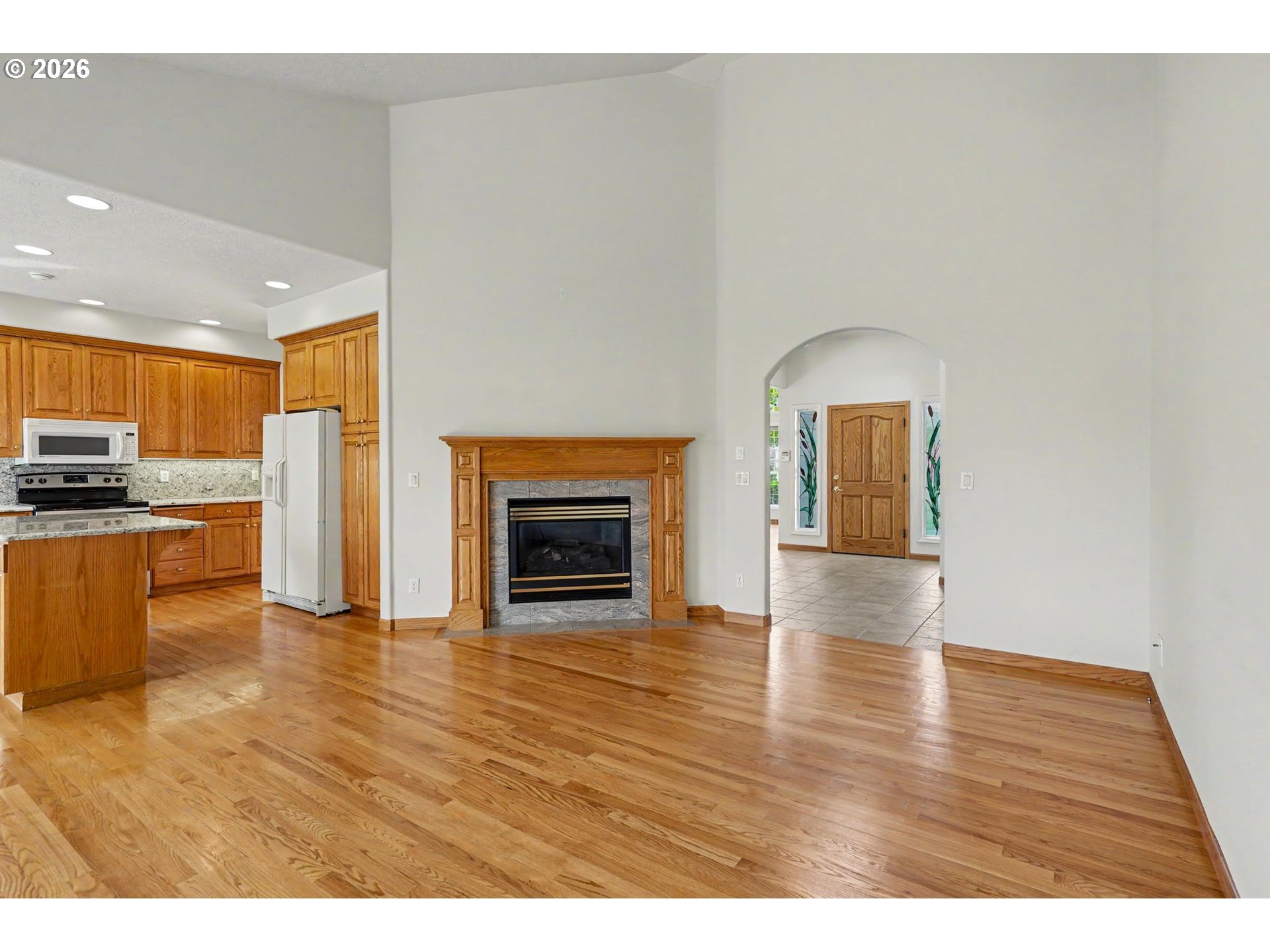 1470 Ranier Loop Northwest Salem, OR 97304 - Photo 25 of 48 a view of empty room with wooden floor and fireplace