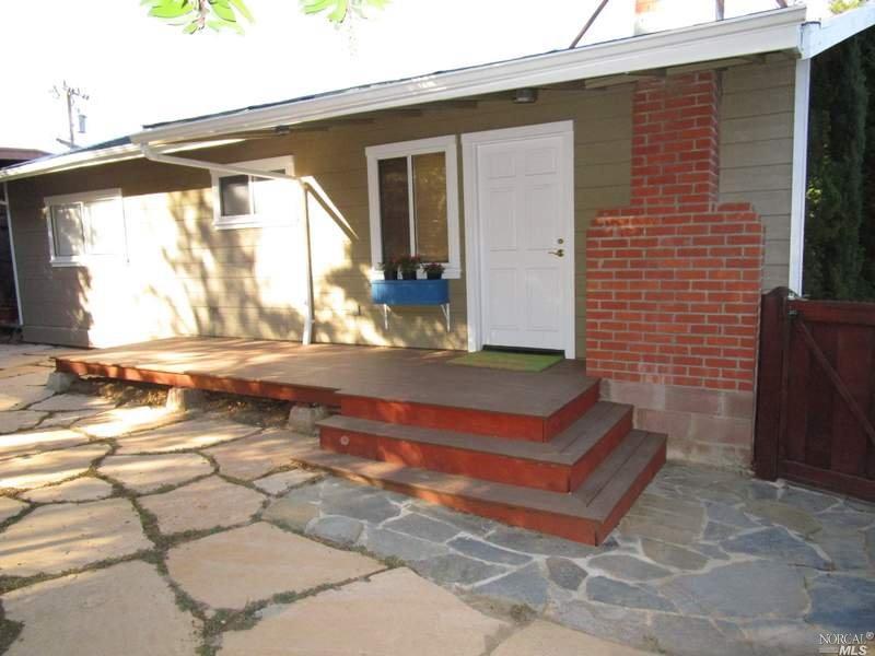 129 Ridge Road Fairfax, CA 94930 - Photo 1 of 1 a view of backyard with a table and chair