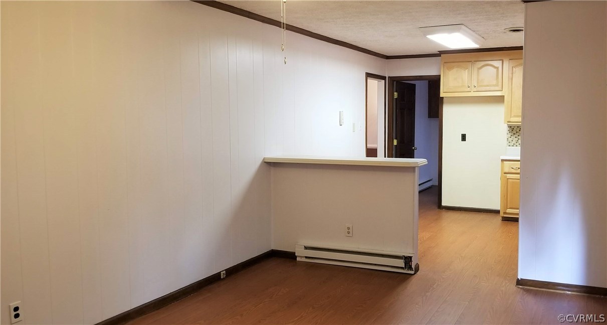 10830 Weybridge Road Chester, VA 23831 - Photo 14 of 33 an empty room with wooden floor and windows