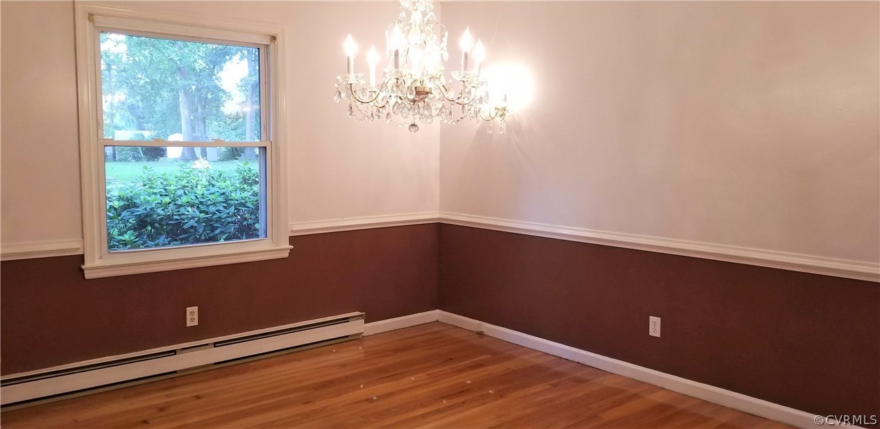 10830 Weybridge Road Chester, VA 23831 - Photo 20 of 33 a view of a chandelier fan and wooden floor