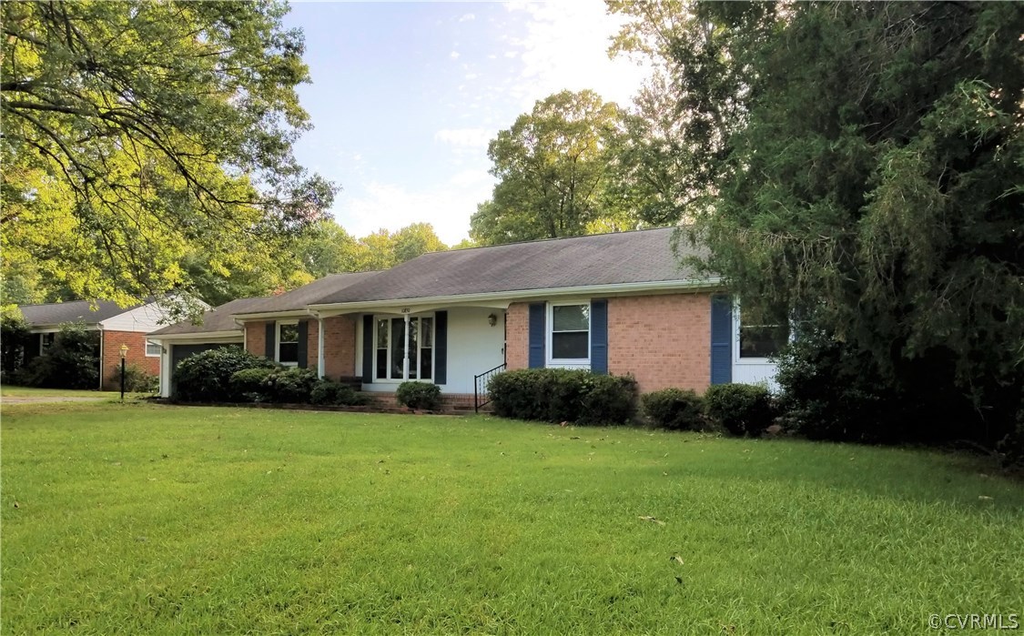 10830 Weybridge Road Chester, VA 23831 - Photo 2 of 33 a view of a house with a yard and large trees