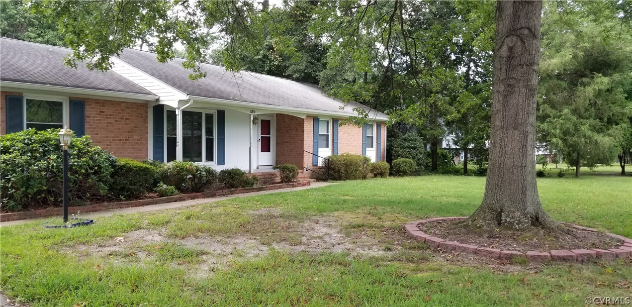 10830 Weybridge Road Chester, VA 23831 - Photo 3 of 33 a front view of a house with a garden