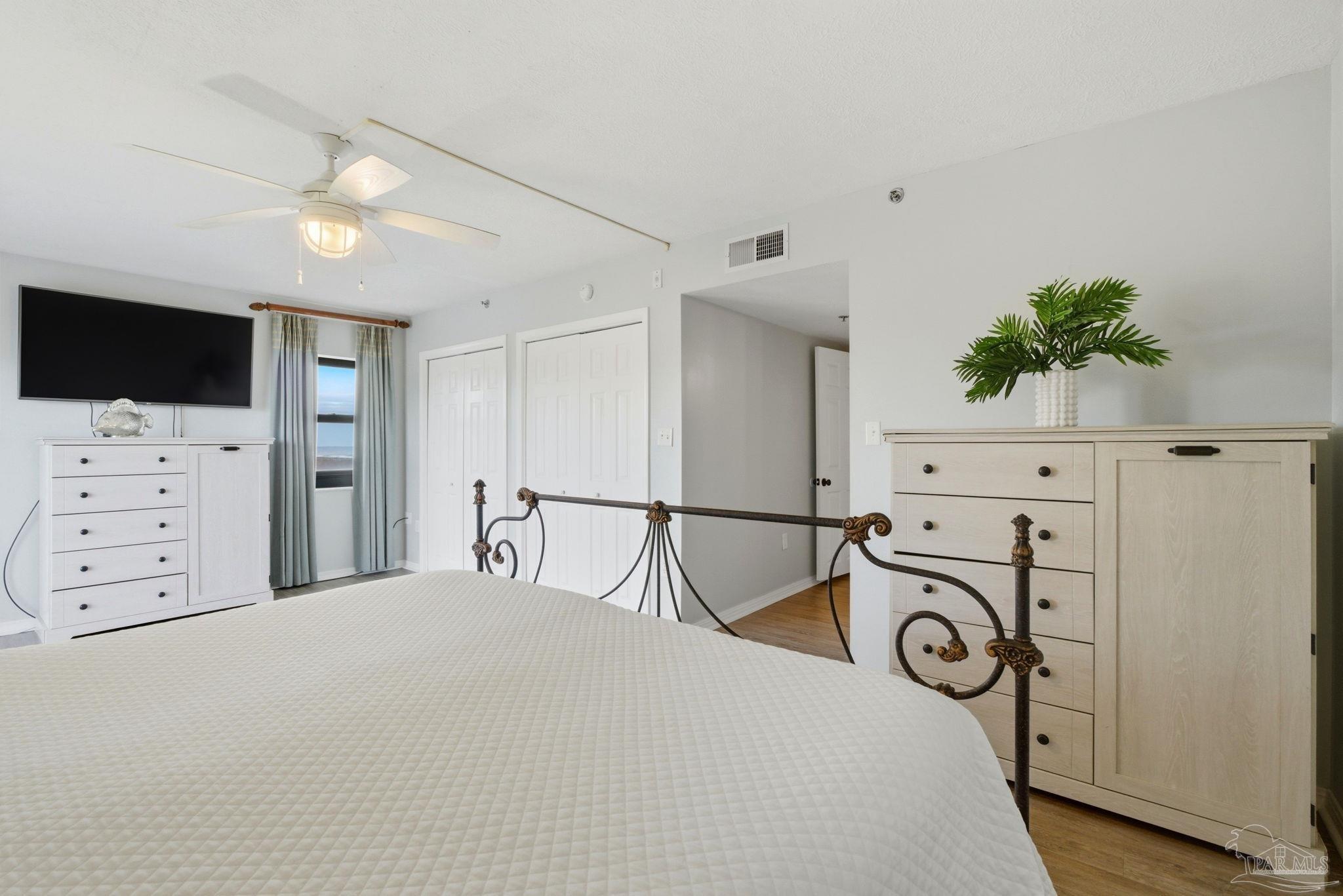 14623 Perdido Key Drive, Unit W201 Perdido Key, FL 32507 - Photo 24 of 57 a bedroom with a bed and a flat screen tv