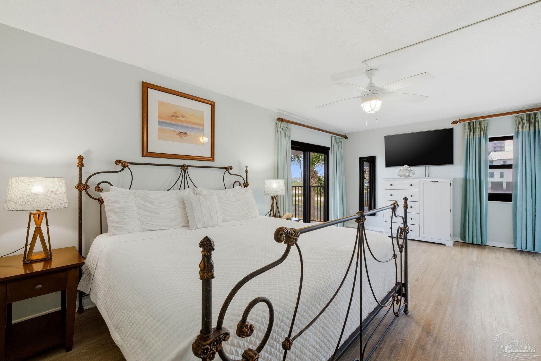 14623 Perdido Key Drive, Unit W201 Perdido Key, FL 32507 - Photo 26 of 57 a bed room with furniture and a flat screen tv