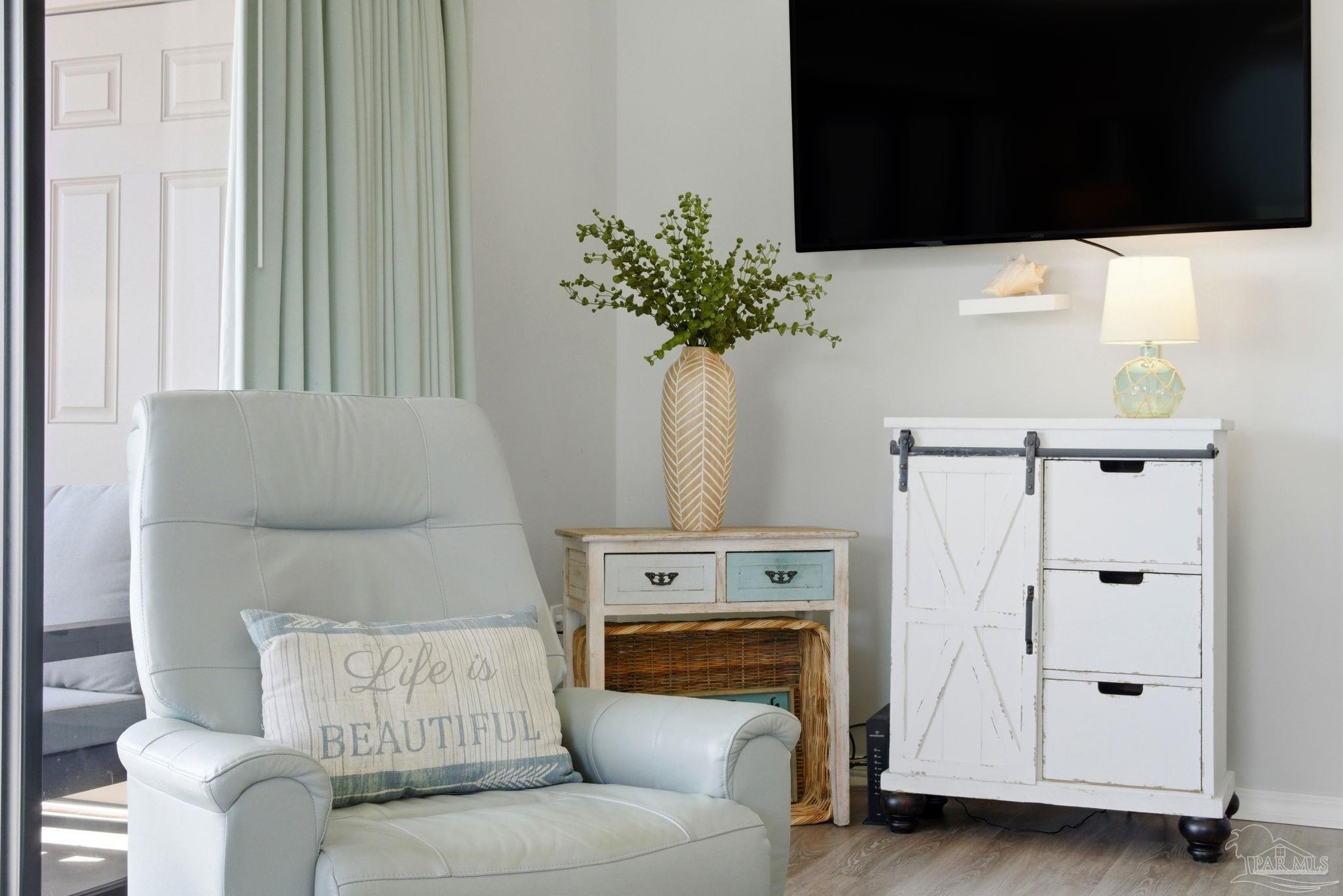 14623 Perdido Key Drive, Unit W201 Perdido Key, FL 32507 - Photo 27 of 57 a living room with furniture and a potted plant