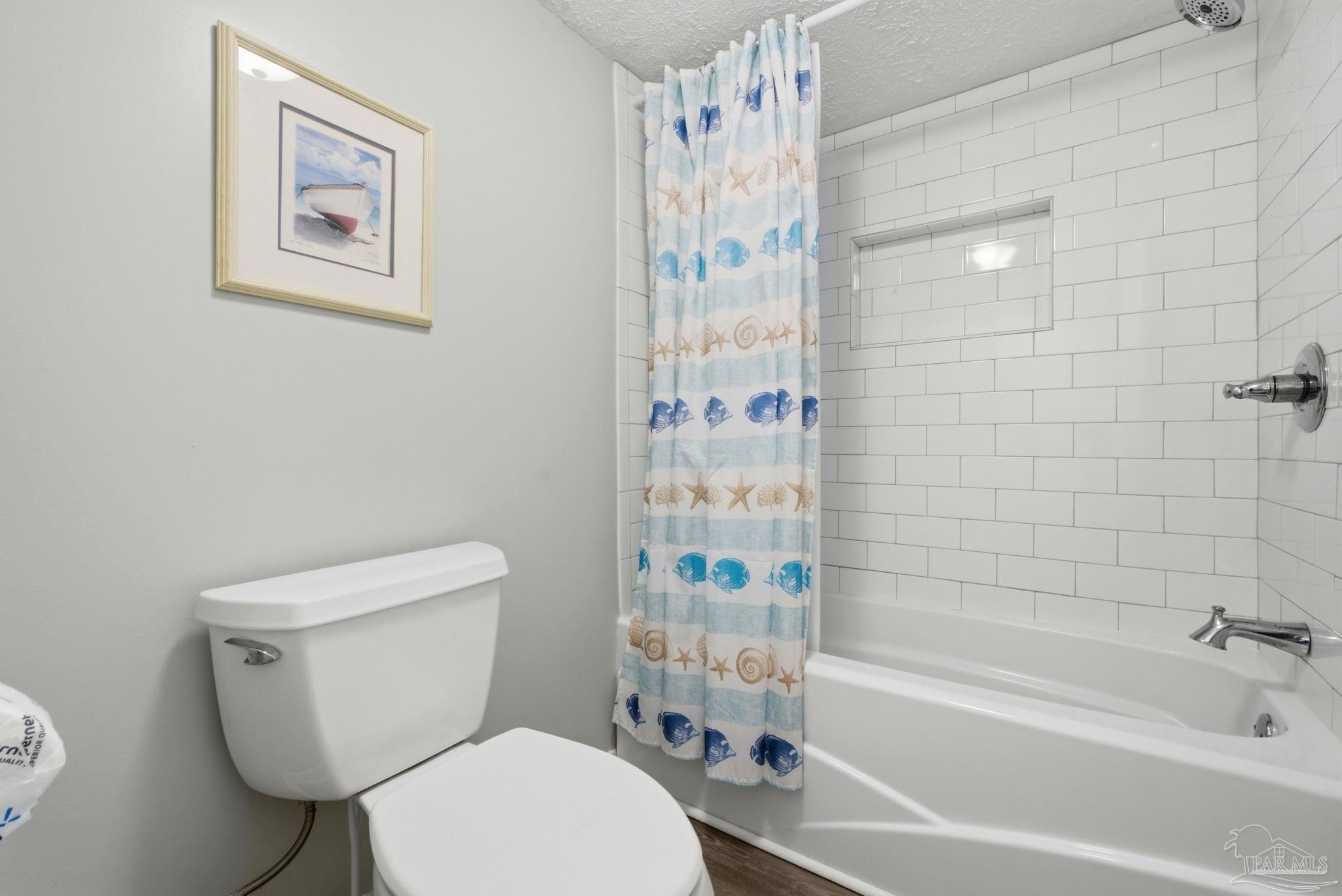 14623 Perdido Key Drive, Unit W201 Perdido Key, FL 32507 - Photo 37 of 57 a white toilet sitting next to a bath tub shower