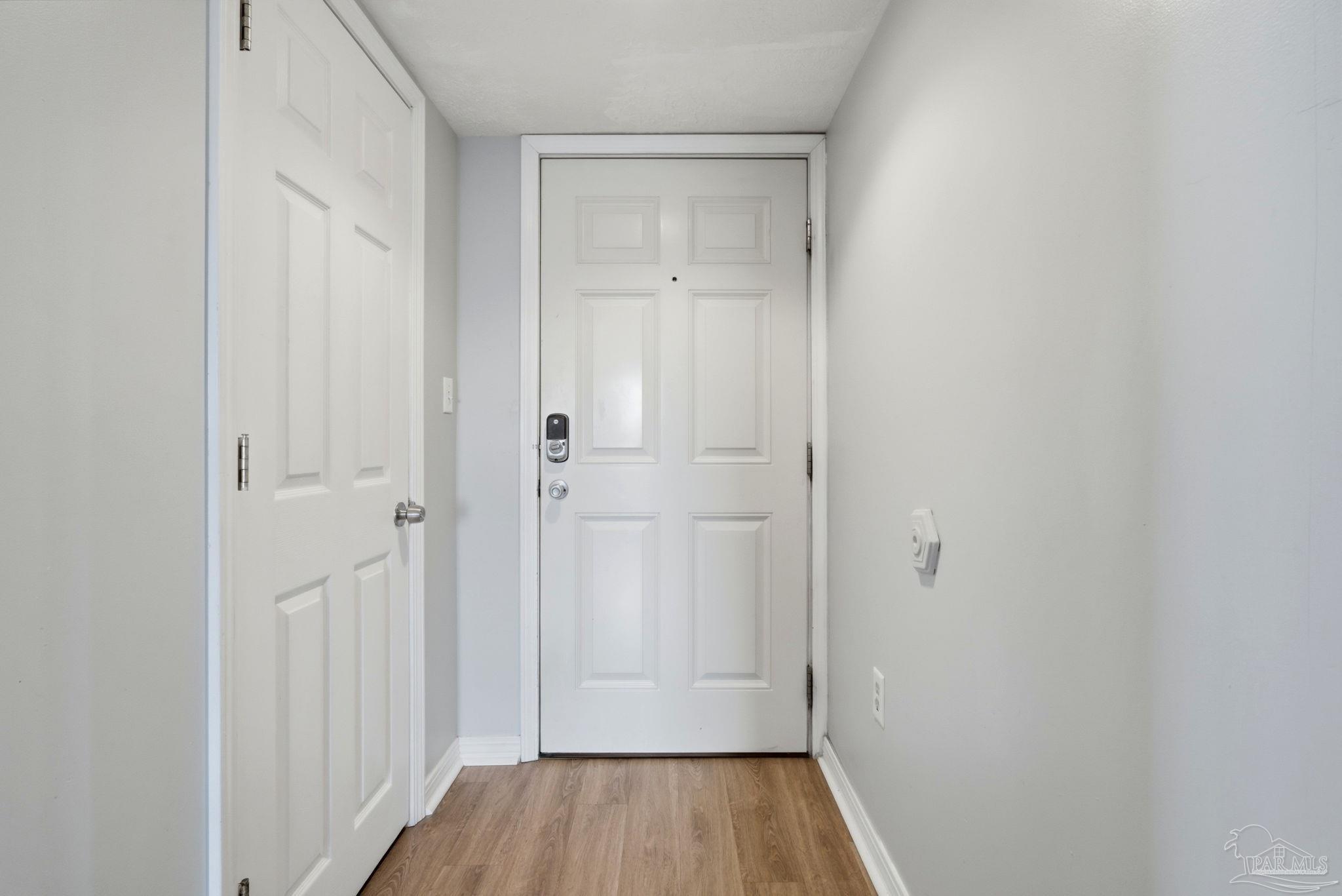 14623 Perdido Key Drive, Unit W201 Perdido Key, FL 32507 - Photo 4 of 57 a view of a hallway with wooden floor