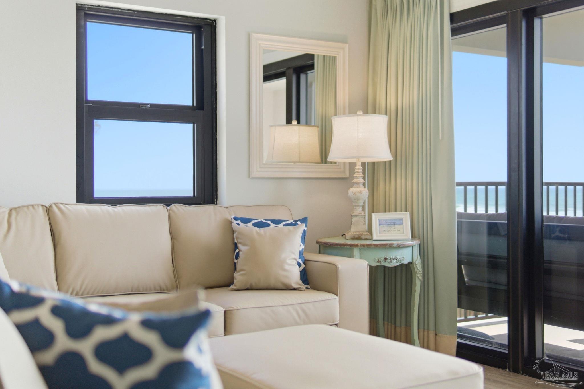 14623 Perdido Key Drive, Unit W201 Perdido Key, FL 32507 - Photo 7 of 57 a living room with a couch and a potted plant