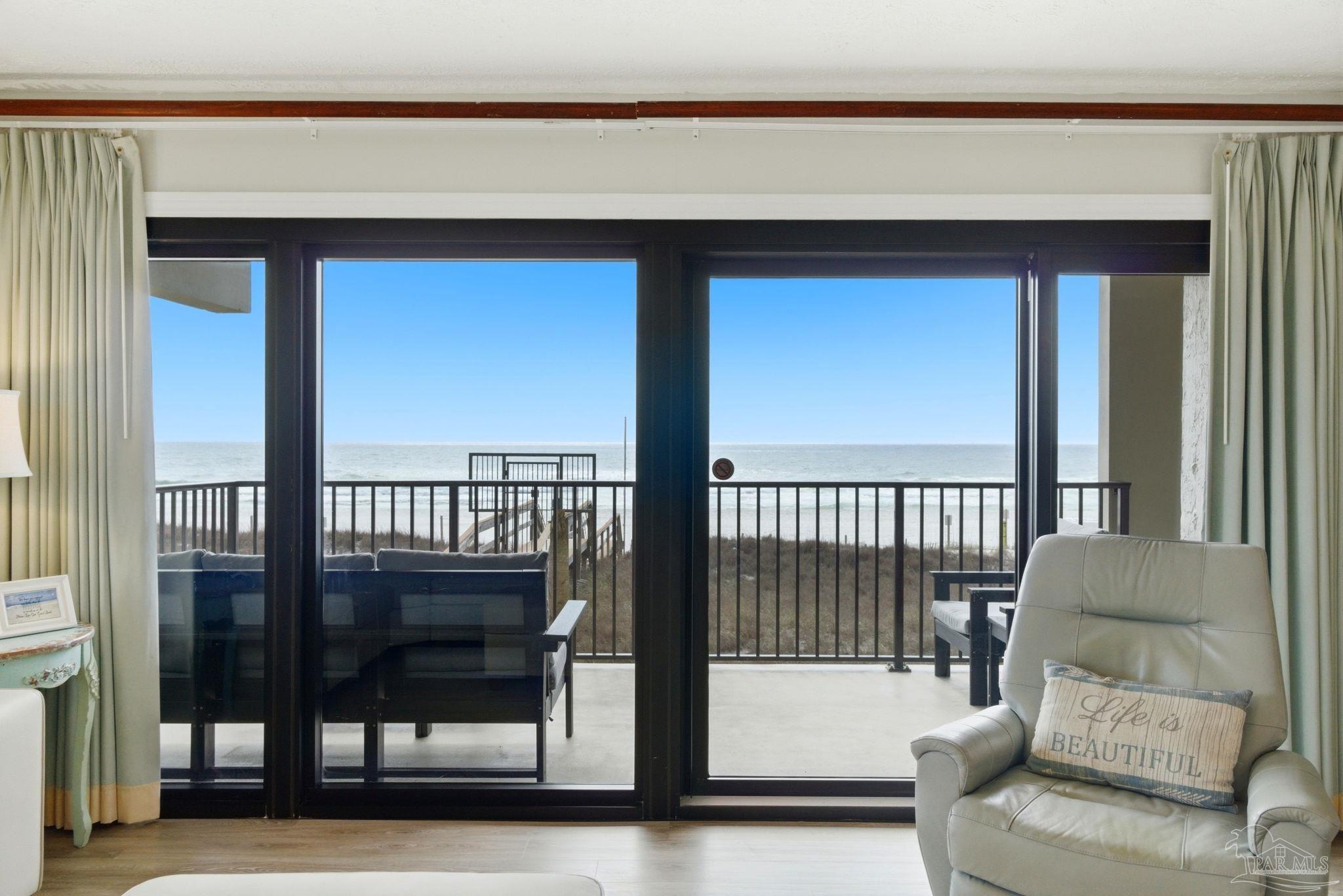 14623 Perdido Key Drive, Unit W201 Perdido Key, FL 32507 - Photo 10 of 57 a living room with furniture and a floor to ceiling window