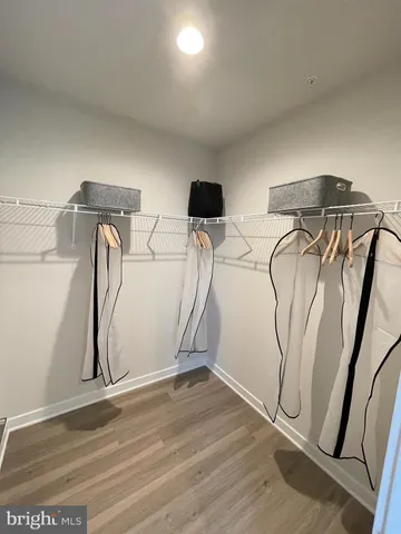 a view of a room with rack and wooden floor