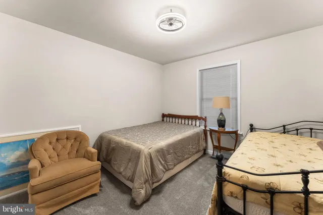 a bedroom with a bed and a table