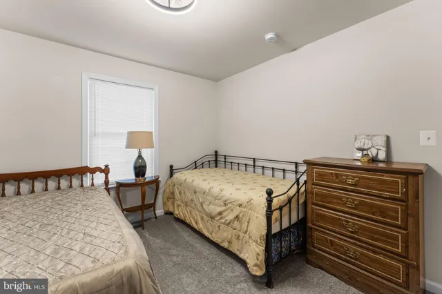 a bedroom with a bed and a table