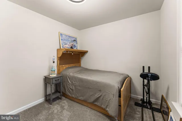 a bedroom with a bed and a table