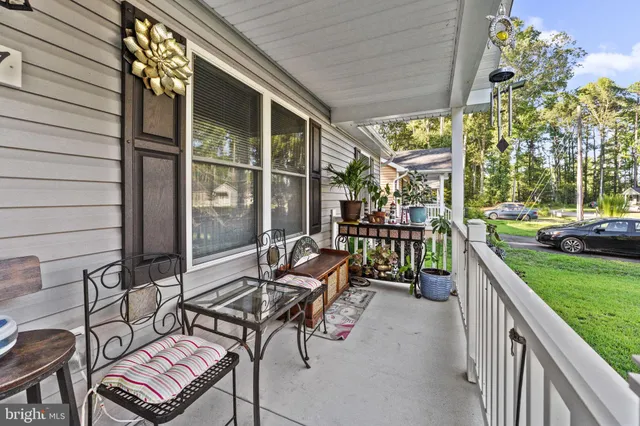 a view of a patio with a table and chairs