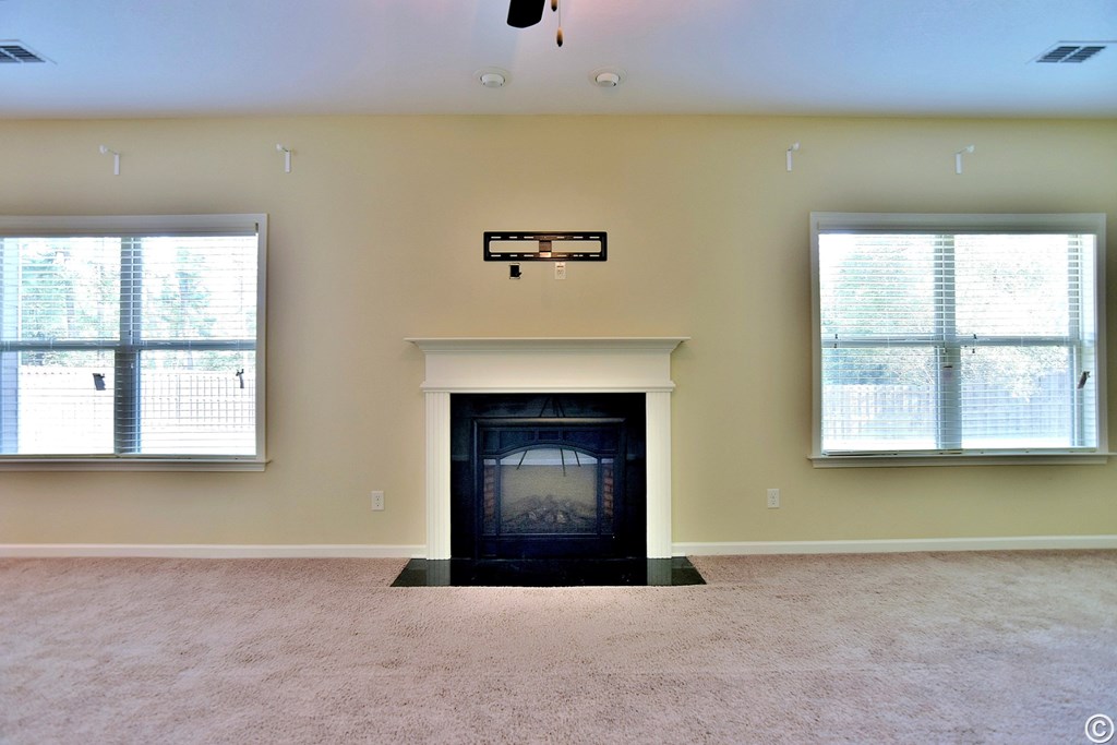 9533 Yarbrough Road Midland, GA 31820 - Photo 12 of 29 a view of a livingroom with a fireplace and a window