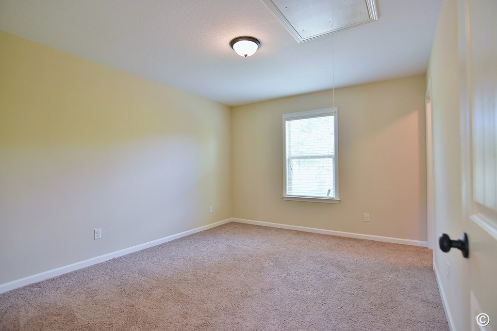 9533 Yarbrough Road Midland, GA 31820 - Photo 19 of 29 an empty room with a window