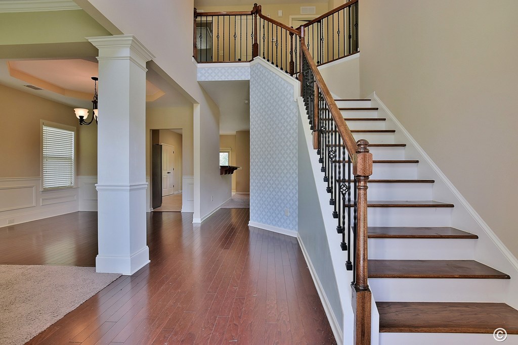 9533 Yarbrough Road Midland, GA 31820 - Photo 3 of 29 a view of staircase with wooden floor and white walls