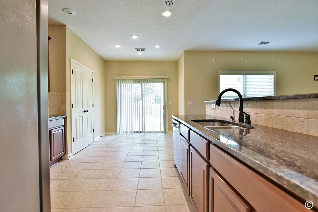 9533 Yarbrough Road Midland, GA 31820 - Photo 8 of 29 a kitchen with a sink and cabinets