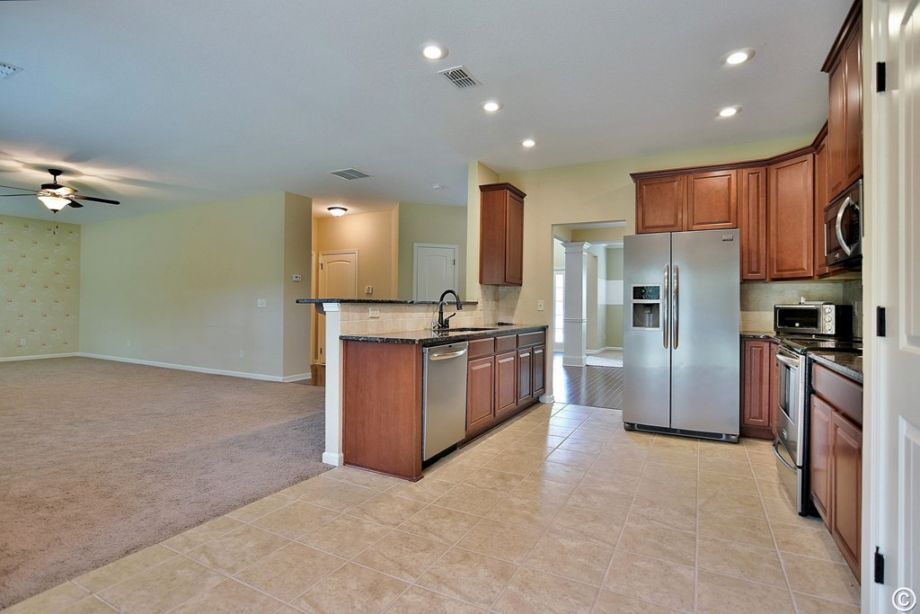 9533 Yarbrough Road Midland, GA 31820 - Photo 10 of 29 a kitchen with stainless steel appliances granite countertop a refrigerator and a stove