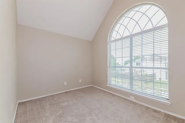 an empty room with a balcony