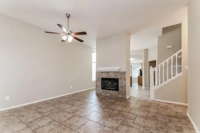a view of an empty room with a fireplace