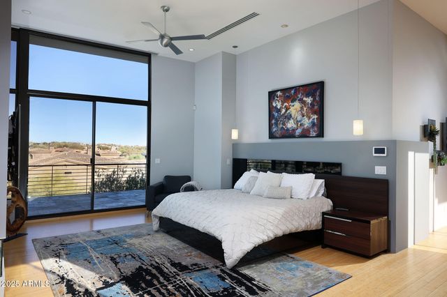 a bedroom with a large bed and a window