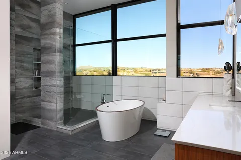 a bathroom with a bathtub and a window
