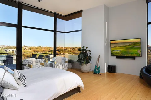 a view of a balcony with furniture