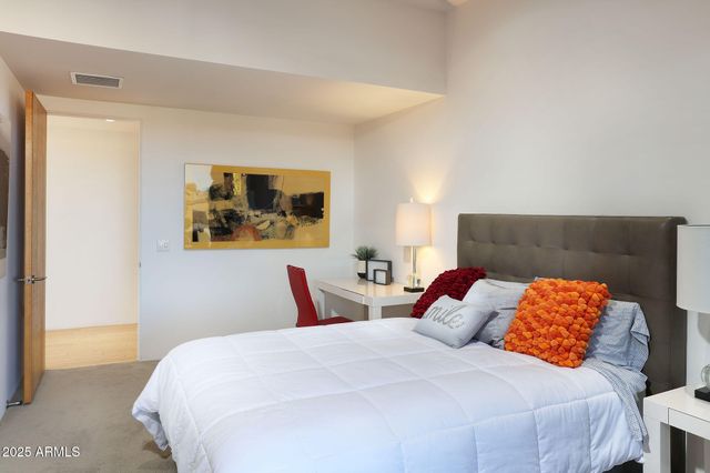 a view of a town with mountains in the background