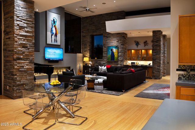 a living room with furniture and kitchen view