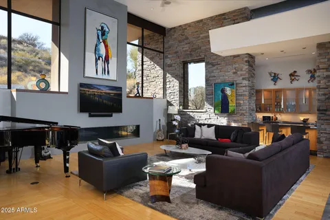 a living room with fireplace furniture and a flat screen tv